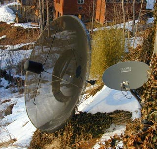 Close view of two satellite dishes